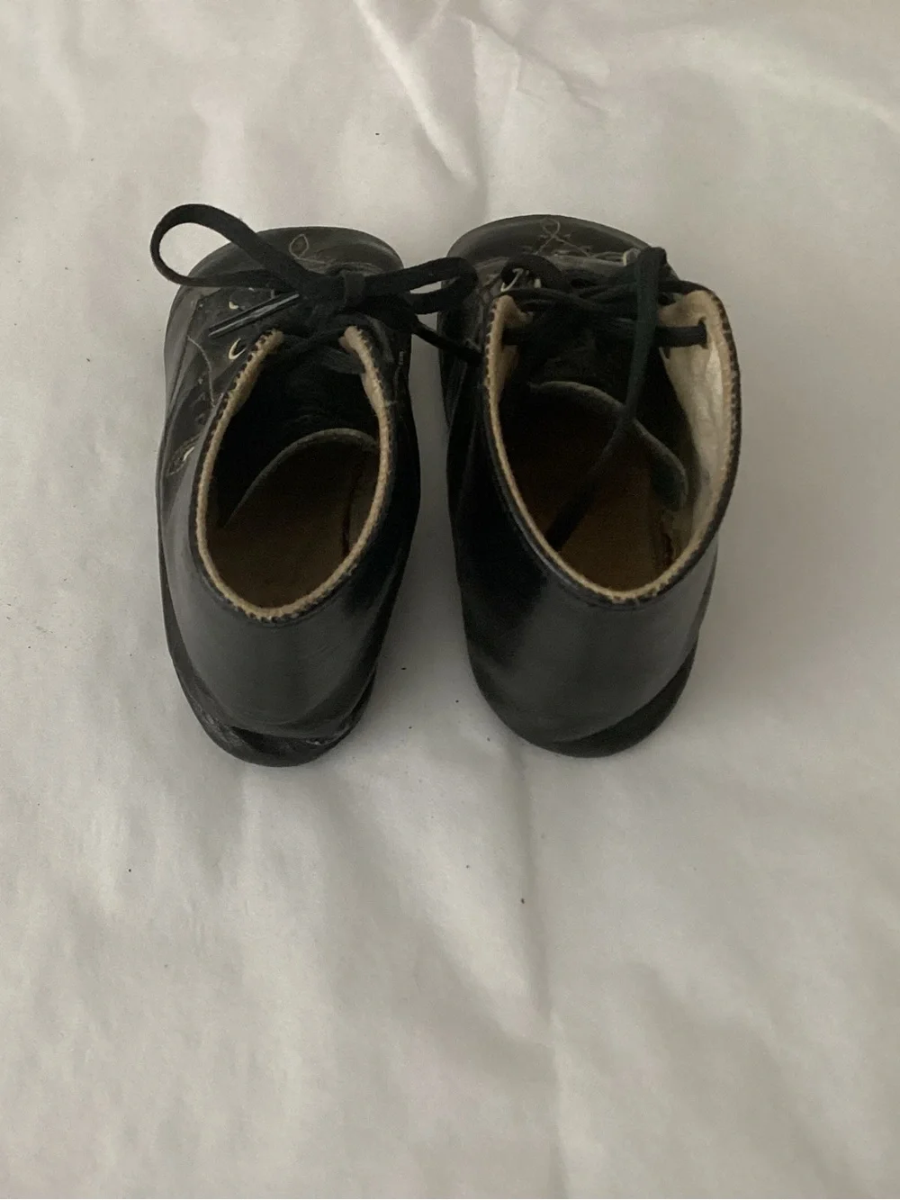 Antique high-top black glazed leather baby shoe, lace-up likely dating from 1920